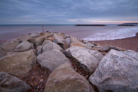 Seascape with breakwaters near the shore in the Sidmouth area of the city. Devon. Englandの写真素材