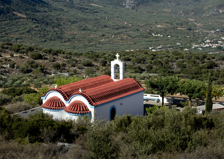 little white church with a red roof. Dikti Mountains. Crete. Greeceの写真素材
