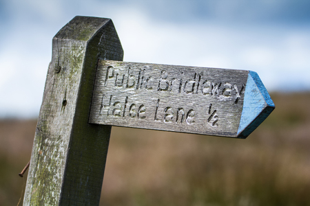 old wooden signpost - Public Bridleway, Halse Lane 1/2. Devon. UKの写真素材