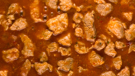 stewed and bubbling goulash after adding waterの写真素材