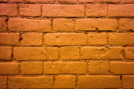 fragment of the wall of brick. Painted in brown paint. backgroundの写真素材