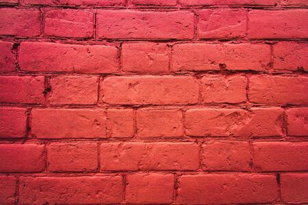 fragment of the wall of brick. Painted in red paint. backgroundの写真素材