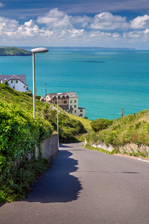 The road between Woolacombe and Mortehoe. In the background, you can see the sea bay and the house. Good warm weather. Summer. North Devon. Englandの写真素材