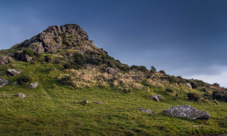 Brentor in the Dartmoor National Park. Evening. The clouds are gathering. Devon. Englandの写真素材