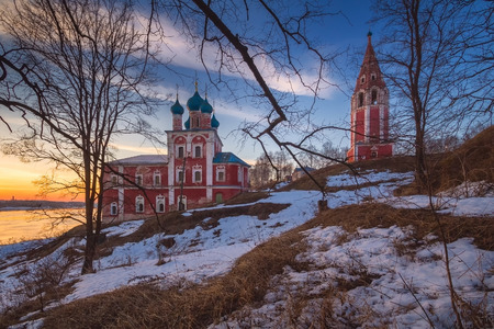 Church in the city of Tutaev. Sunset. Early spring. The snow is visible. Yaroslavl region. Russiaの写真素材