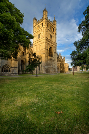North tower of the cathedral in Exeter. It is illuminated by the low sun. Early morning. Devon. Englandの写真素材