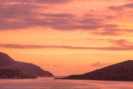 A magnificent dawn over Mirabello Bay. Also seen is the island of Spinalonga. Crete. Greeceの写真素材
