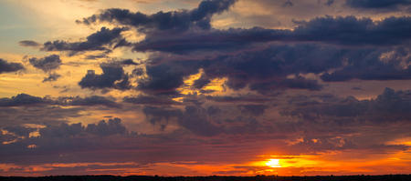 Dramatic sky at sunset on a summer evening.の写真素材