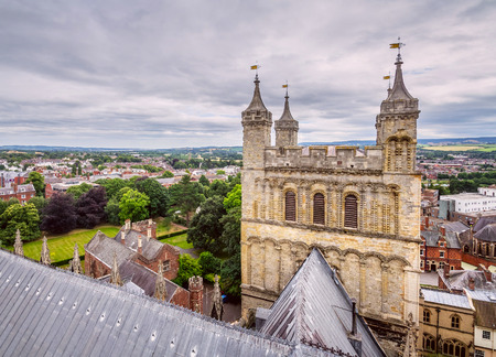 View of the city of Exeter from one of the towers of the cathedral. Also one of the towers is visible in the foreground. Devon. Englandのeditorial素材