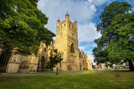 The famous Exeter Cathedral. The main attraction of the city. Early summer morning. The walls are illuminated by the low rising sun. Nobody. Exeter. Devon. Englandの写真素材