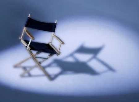 DIRECTORS CHAIR IN SPOTLIGHTの写真素材
