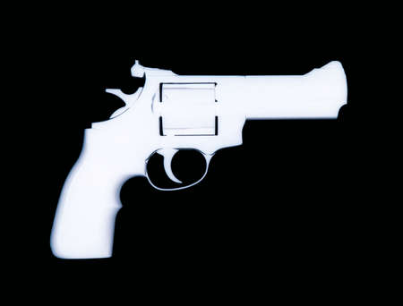 XRAY IMAGE OF HANDGUN ISOLATED ON BLACK BACKGROUND