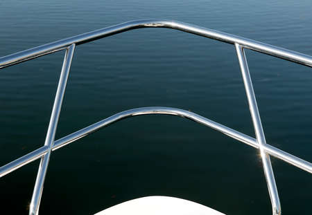 CHROME HAND RAIL ON BOW OF BOATの写真素材