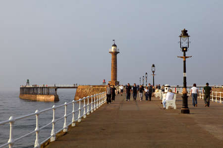 WHITBY PIER AND LIGHTHOUSE YORKSHIRE ENGLAND UKのeditorial素材