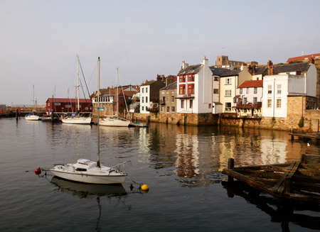 WHITBY HARBOUR OLD SIDE AND SAINT HILDAS CHURCHのeditorial素材