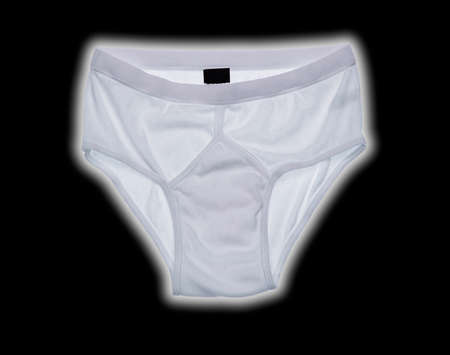 PAIR OF WHITE Y FRONT UNDERPANTS ISOLATED ON BLACK BACKGROUND