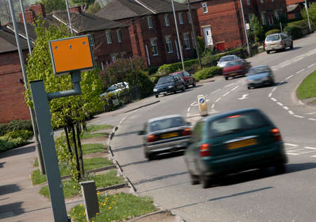 VEHICLES BRAKING NEAR TO YELLOW GATSO ROAD TRAFFIC SPEED CAMERAのeditorial素材