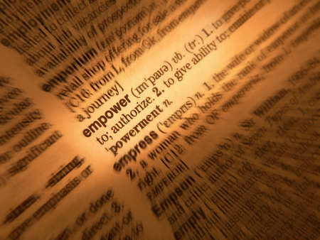 Close up of dictionary page showing definition of the word empowerの写真素材