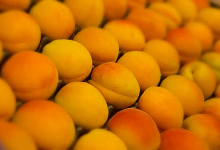 Fresh peaches on supermarket shelf in close upの写真素材