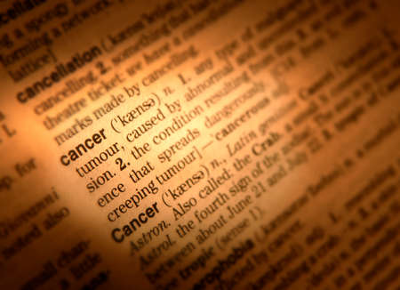 Close up of dictionary page showing definition of the word cancerの写真素材