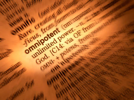 Close up of dictionary page showing definition of the word omnipotentの写真素材