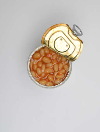 Baked beans in open tin can on white backgroundの写真素材