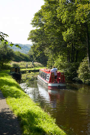 Canal barge at Salterhebble lock in Yorkshire, England
