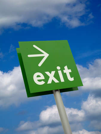 Green exited sign isolated against blue sky and clouds