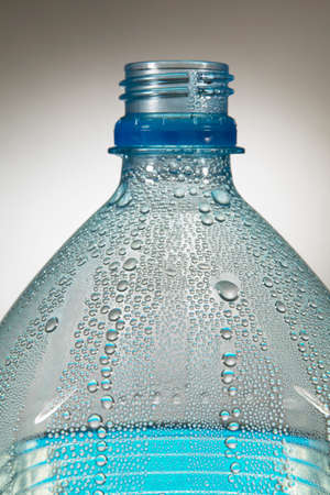 Water droplets condensing inside plastic bottle in close upの写真素材