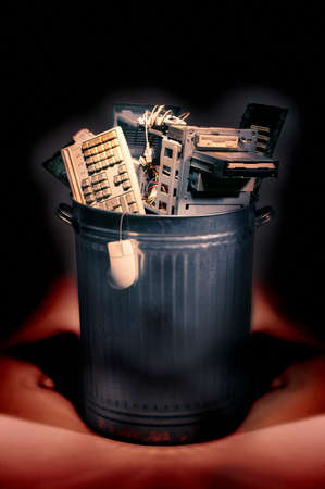 Trash can full of obsolete scrap computer equipment