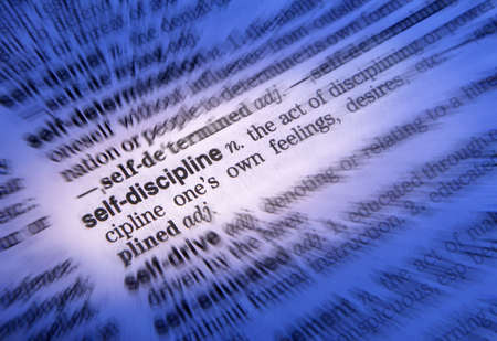 Close up of dictionary page showing definition of the word self-discipline
