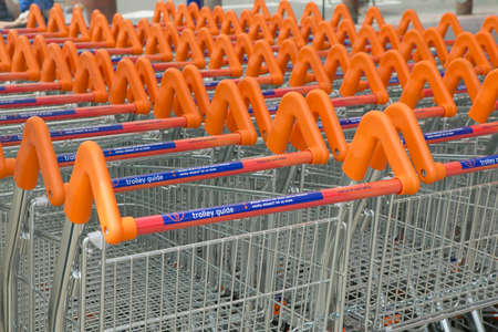 Supermarket trolleys parked in rows in close up