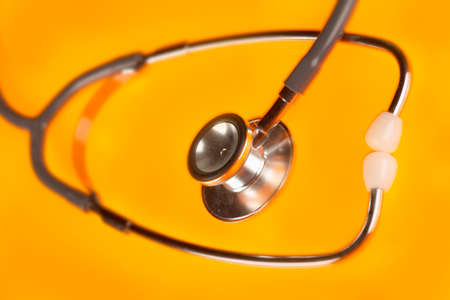 Stethoscope on yellow backgroundの写真素材