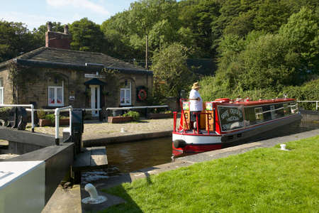 Canal barge at Salterhebble lock, Yorkshire, Englandのeditorial素材