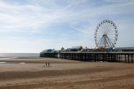 Blackpool beach and north pier with ferris wheel in backgroundのeditorial素材