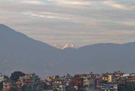 Mountains over cityの写真素材