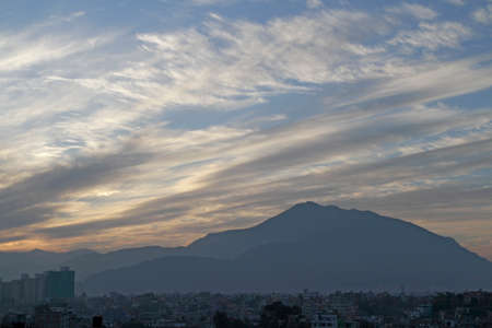 Mountains over cityの写真素材