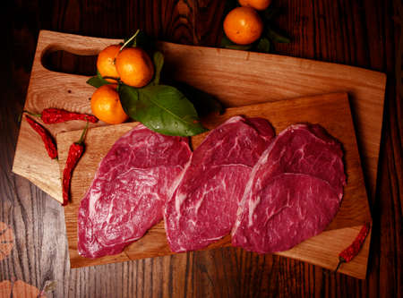 Raw meat on a cutting boardの写真素材