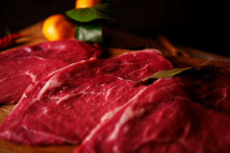 Raw meat on a cutting boardの写真素材