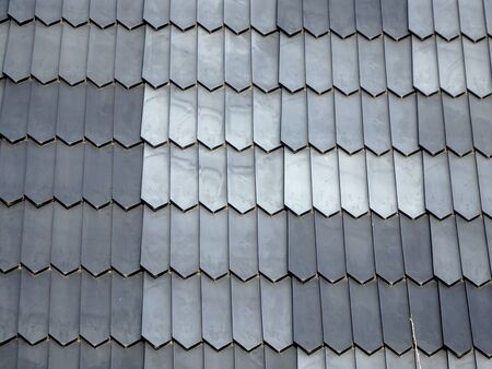 background of gray rectangular shingles on roof,の写真素材