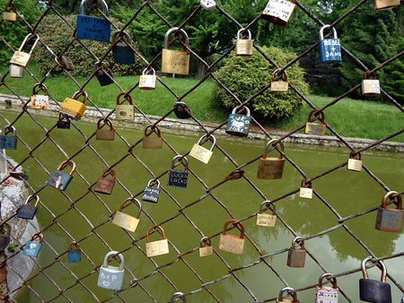 Love lock on grid,  lock -  symbol of loyalty and eternal love