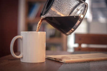 cup of hot coffee on the tableの写真素材