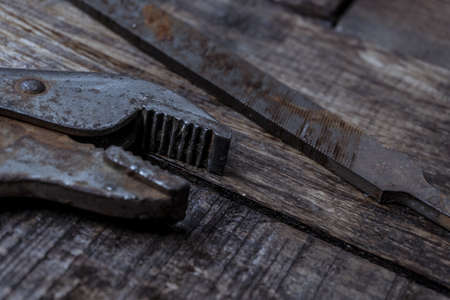 Old and rusty tools on work table