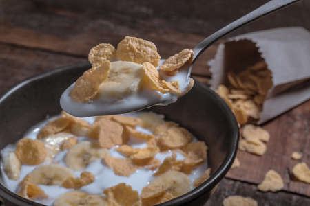 corn flakes with milk and banana chunks for breakfast