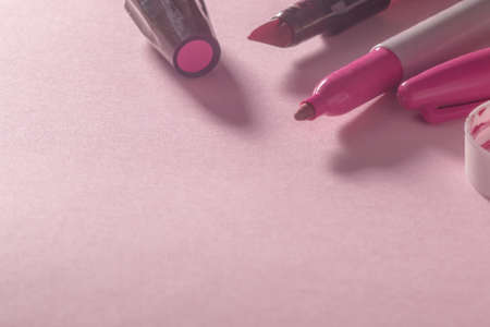 markers and pink paint on pink backgroundの写真素材