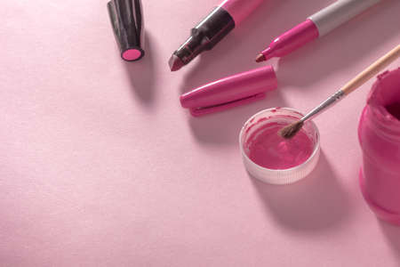 markers and pink paint on pink backgroundの写真素材