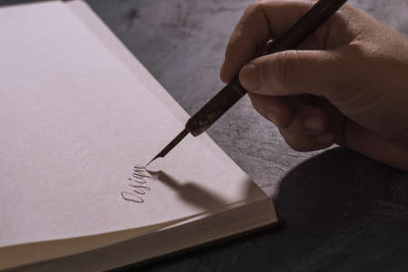 traditional handwritten calligraphy, on an old book.の写真素材