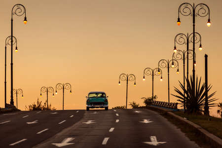 Old car on street of Havana at sunset, Cubaの写真素材