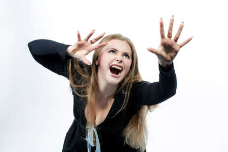expressive agression of young blond looking up isolated on white backgroundの写真素材