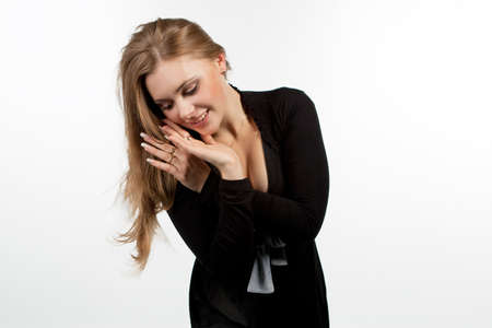 shy and pretty blond isolated on whiteの写真素材